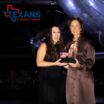 Query successful Two women holding an award with an eagle and American flag, Texans for Medical Freedom logo present.